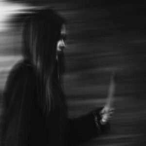 Woman walking with an object blurry background