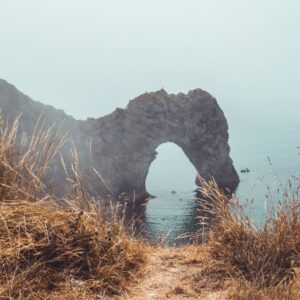 Cliff with water below and rock formation