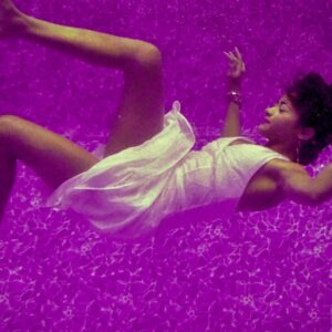 Lady falling in purple water