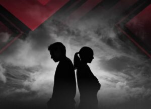 Silhouette of man and woman standing back to back